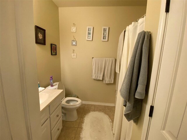 bathroom with tile patterned flooring, a shower with shower curtain, vanity, and toilet