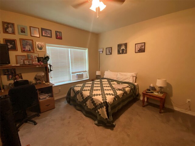 bedroom with ceiling fan, carpet, and cooling unit