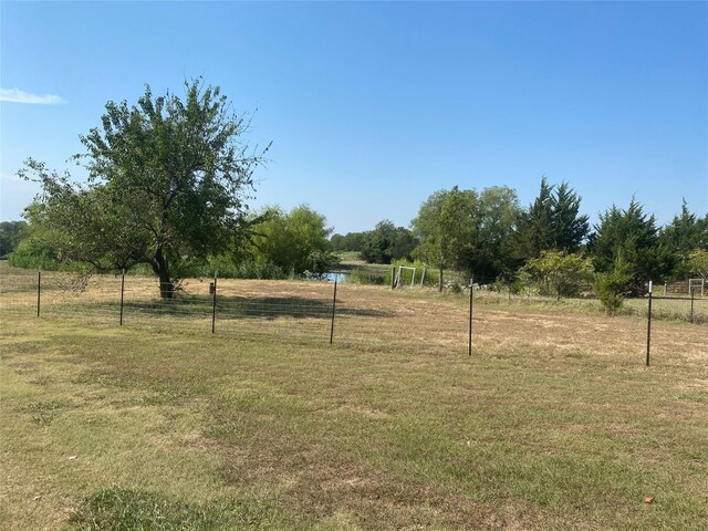 view of yard with a rural view