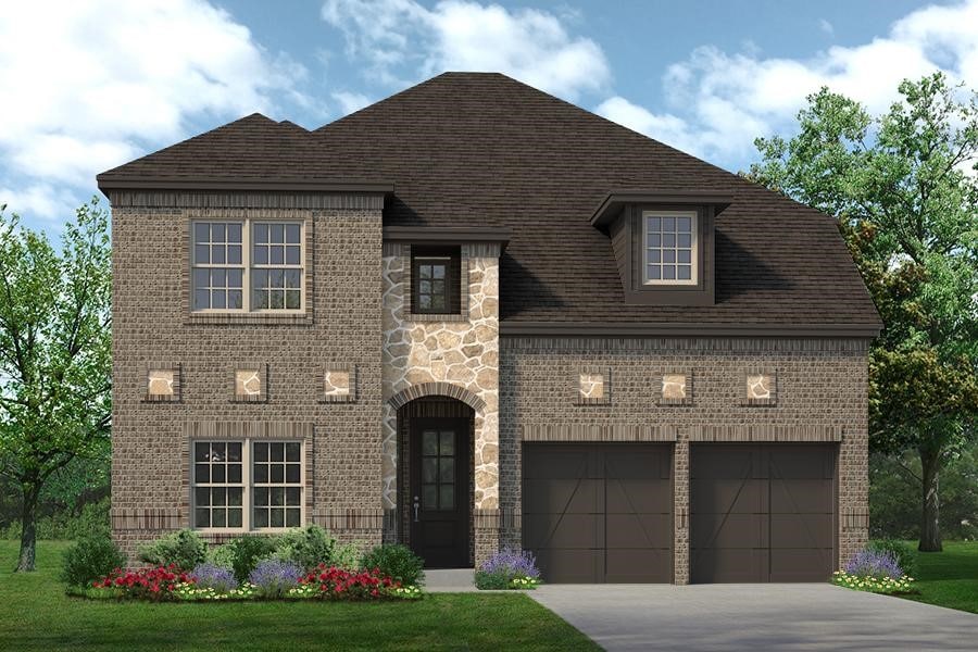 view of front of home featuring a garage and a front yard