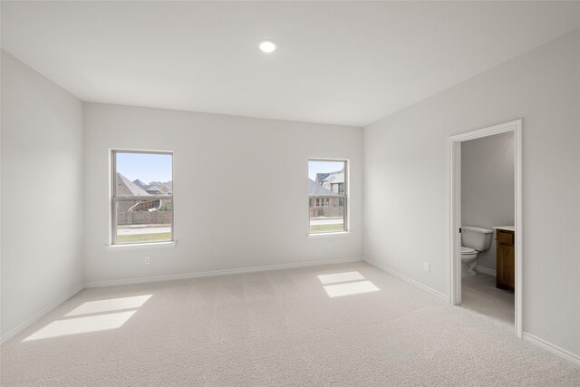 empty room with recessed lighting, baseboards, and carpet floors