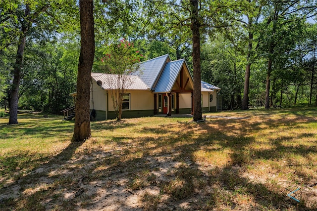 view of home's exterior with a yard and covered porch