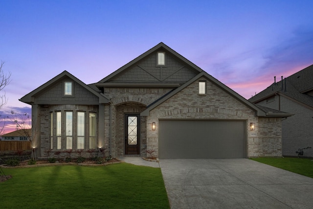 view of front facade featuring a yard and a garage