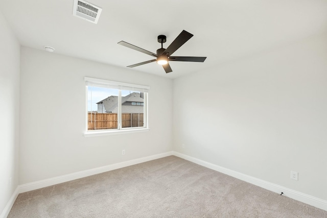 carpeted empty room with ceiling fan