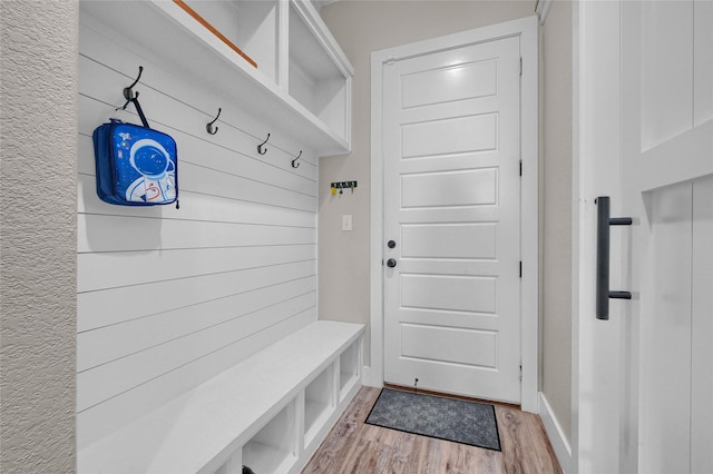 mudroom with light wood-style flooring