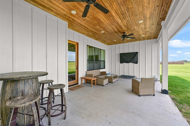 view of patio with a ceiling fan and outdoor dry bar