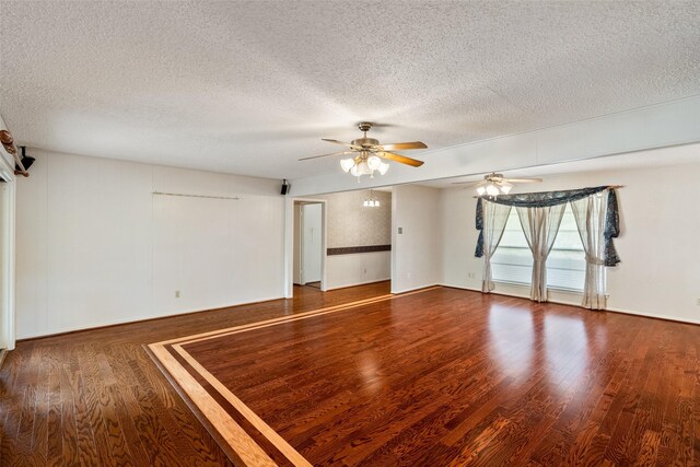 spare room with ceiling fan, wood-type flooring, and a textured ceiling