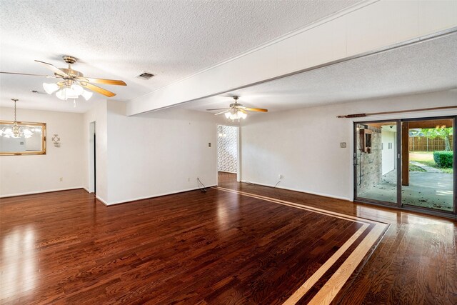 empty room featuring a textured ceiling, ceiling fan with notable chandelier, and wood-type flooring