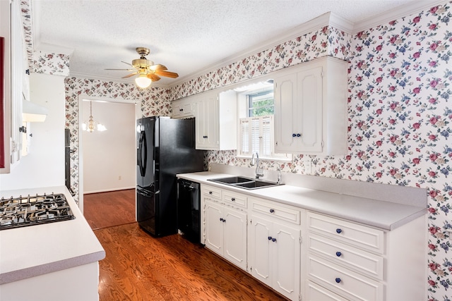 kitchen with sink, white cabinets, hardwood / wood-style flooring, and dishwasher