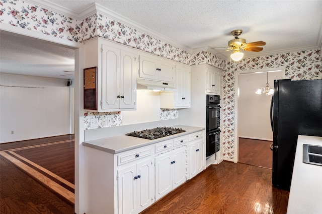 kitchen featuring ceiling fan with notable chandelier, dark hardwood / wood-style floors, white cabinetry, crown molding, and black appliances