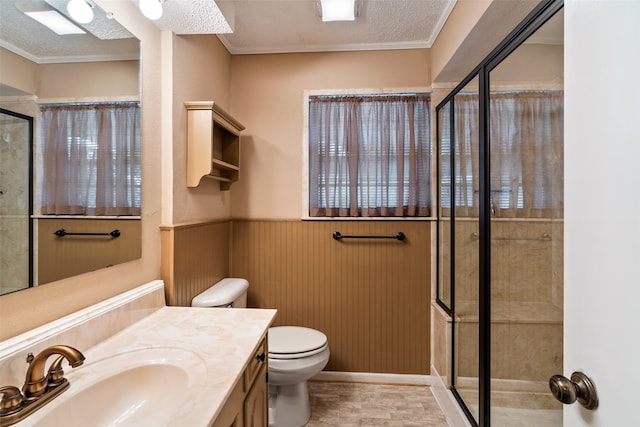 bathroom featuring vanity, tile patterned flooring, a textured ceiling, an enclosed shower, and toilet