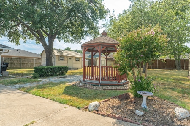 exterior space with a lawn and a gazebo