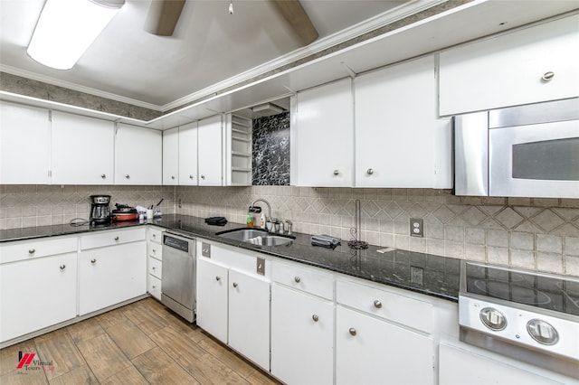 kitchen featuring white cabinets, stainless steel appliances, and sink