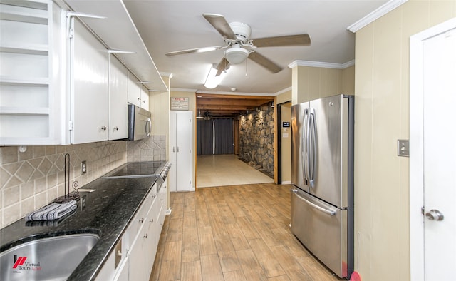 kitchen featuring white cabinetry, light hardwood / wood-style flooring, appliances with stainless steel finishes, ornamental molding, and ceiling fan