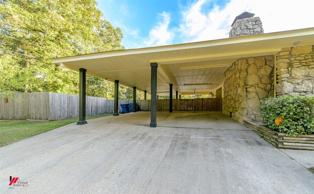 view of parking / parking lot featuring a carport