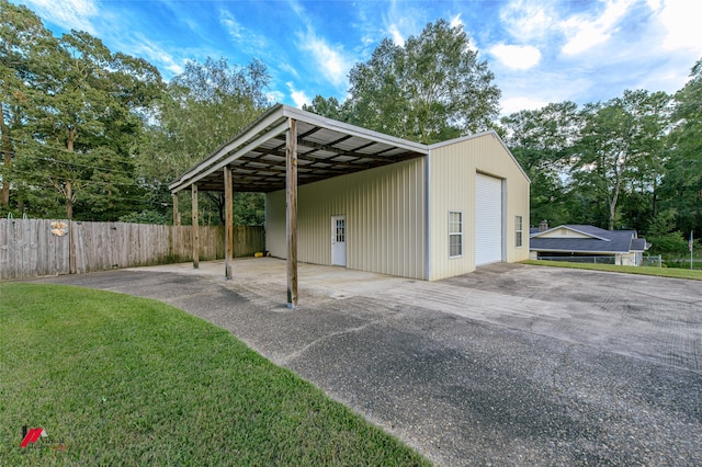 exterior space featuring a carport and a yard