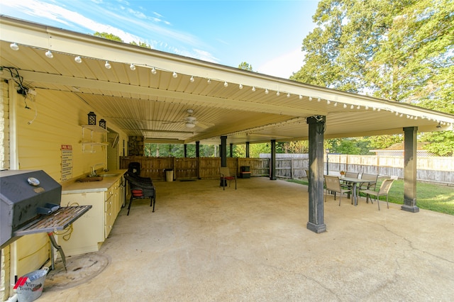 view of patio with sink and ceiling fan