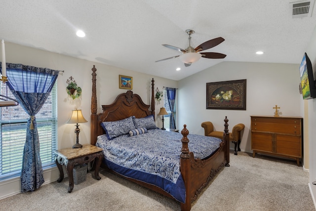 bedroom featuring ceiling fan, light colored carpet, a textured ceiling, and lofted ceiling