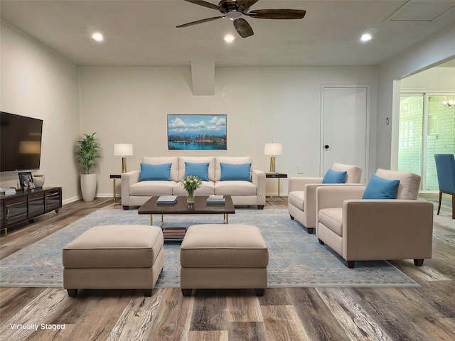 living room featuring hardwood / wood-style flooring and ceiling fan