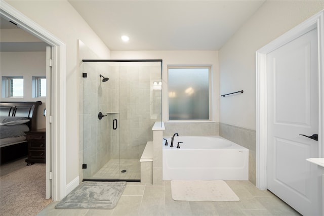 bathroom featuring separate shower and tub and tile patterned floors