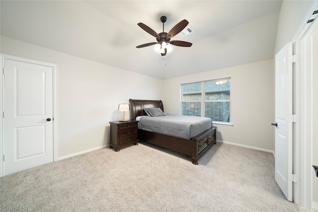 carpeted bedroom featuring lofted ceiling and ceiling fan