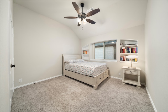 bedroom with lofted ceiling, ceiling fan, and light colored carpet