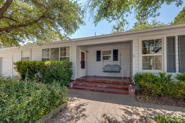 property entrance with a porch