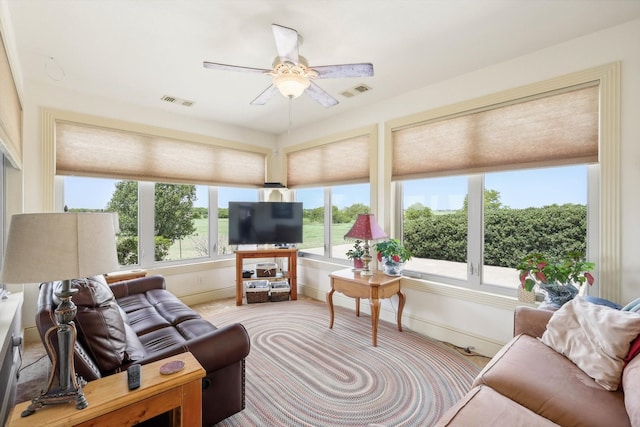 living room with ceiling fan and light carpet