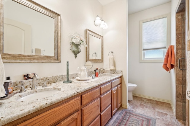 bathroom featuring toilet, double vanity, and tile patterned floors