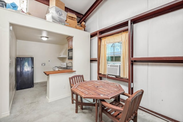 dining room with beam ceiling and cooling unit