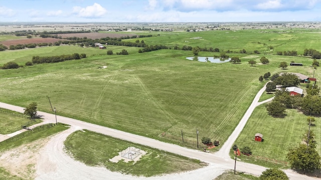 birds eye view of property featuring a rural view