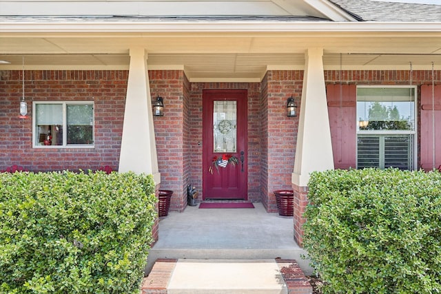 property entrance featuring a porch