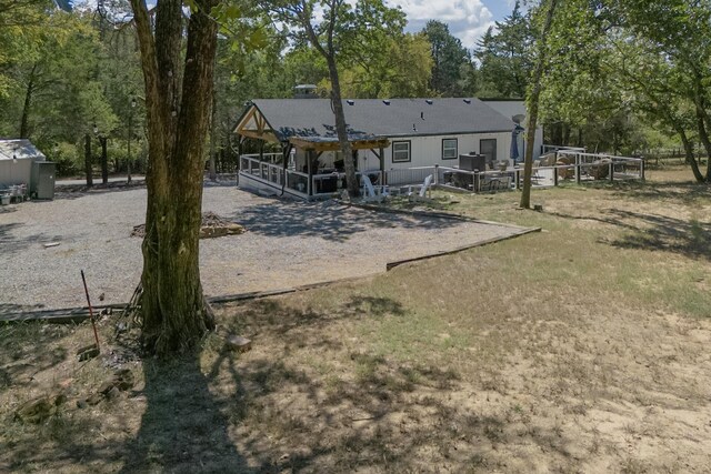 rear view of house featuring a patio