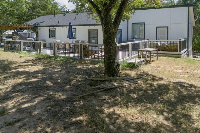 rear view of house with a deck