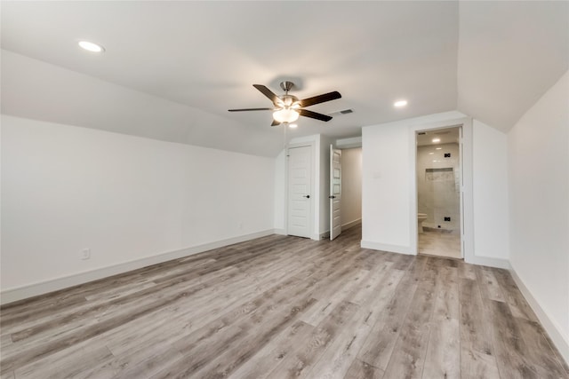 bonus room featuring ceiling fan, light hardwood / wood-style floors, and vaulted ceiling