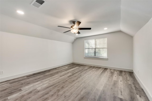 additional living space featuring ceiling fan, light hardwood / wood-style floors, and lofted ceiling