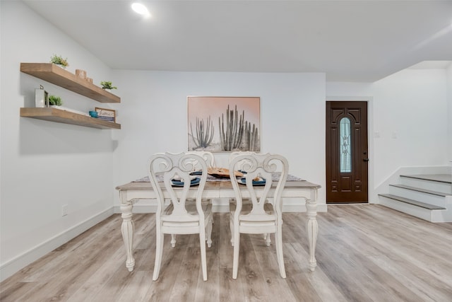 dining space featuring light wood-type flooring