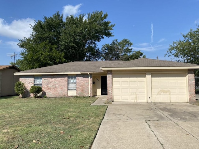 ranch-style house with brick siding, a garage, concrete driveway, and a front yard