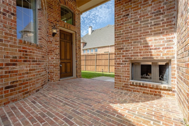 view of patio / terrace with an outdoor fireplace