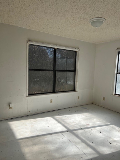 spare room featuring a textured ceiling