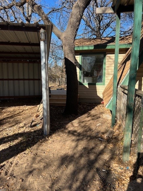 view of side of property featuring a carport