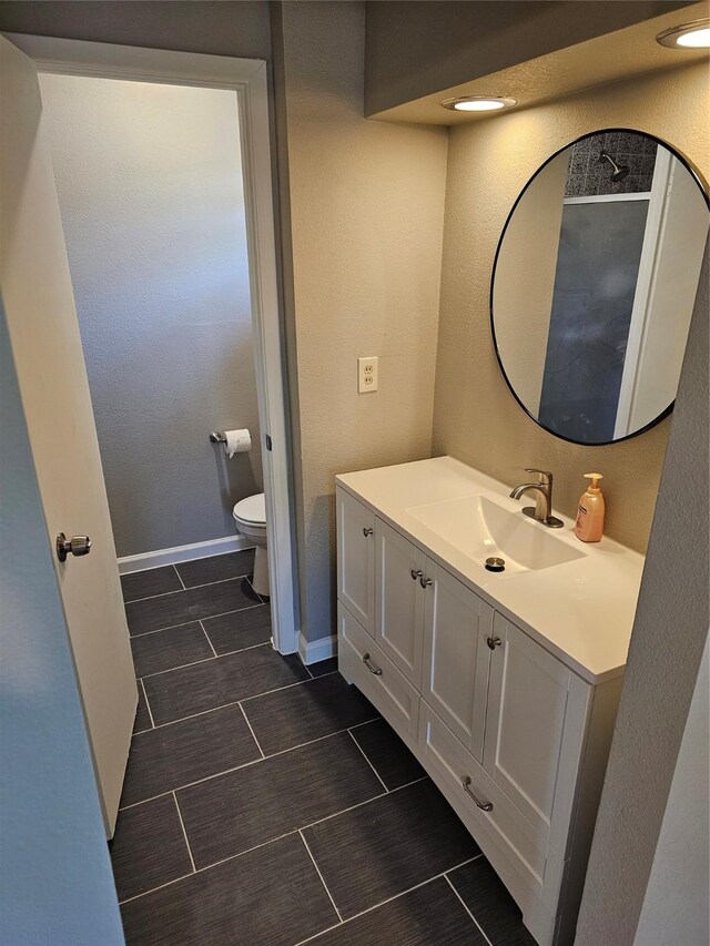 empty room with ceiling fan, a wealth of natural light, and dark hardwood / wood-style flooring