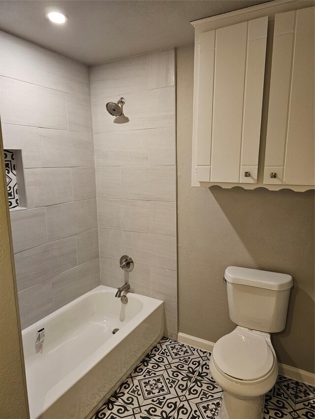 unfurnished bedroom with dark wood finished floors, a closet, visible vents, a textured ceiling, and baseboards