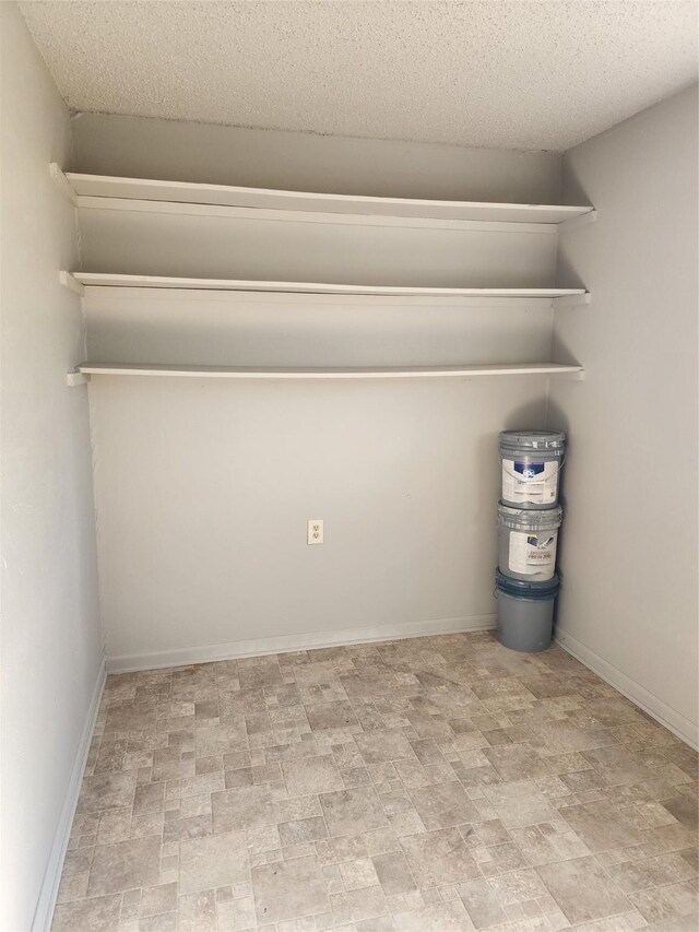 full bathroom featuring shower / washtub combination, tile patterned flooring, baseboards, and toilet