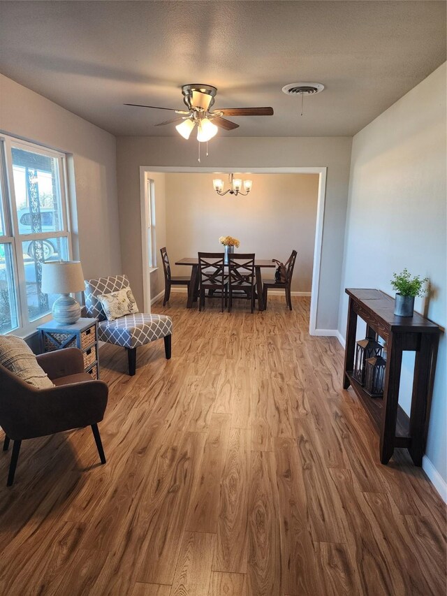 kitchen featuring white cabinetry, appliances with stainless steel finishes, plenty of natural light, and dark hardwood / wood-style floors