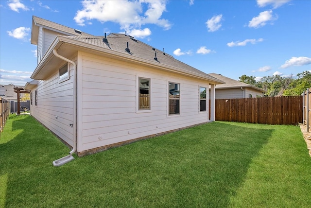 back of house featuring a yard