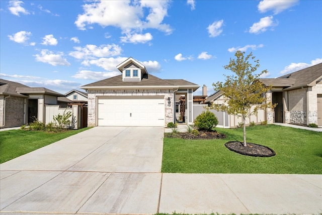 view of front of property with a garage and a front yard