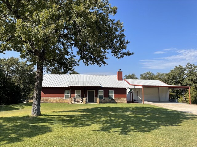 ranch-style home featuring a carport and a front yard