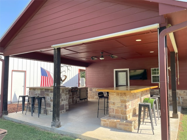 view of patio / terrace with an outdoor bar