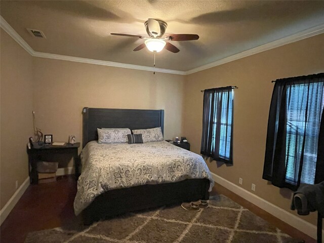 bedroom with ceiling fan and ornamental molding